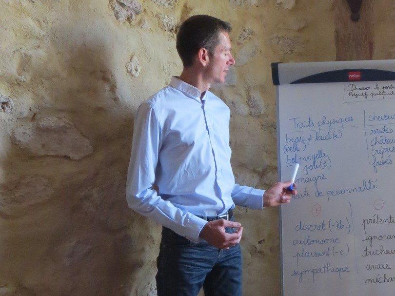 Specialised French courses: the teacher leading a session at the flipchart